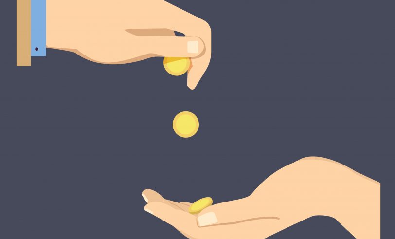 Coins dropping into hand