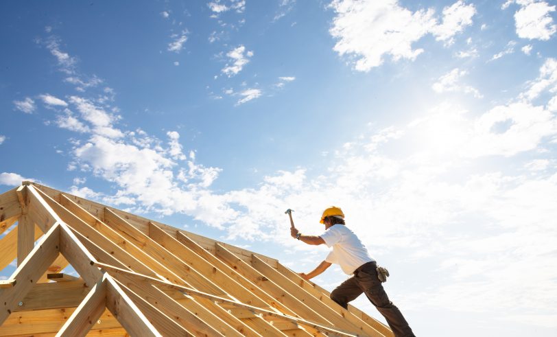 Guy building house