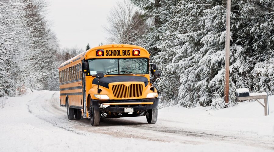 School bus on road in winter