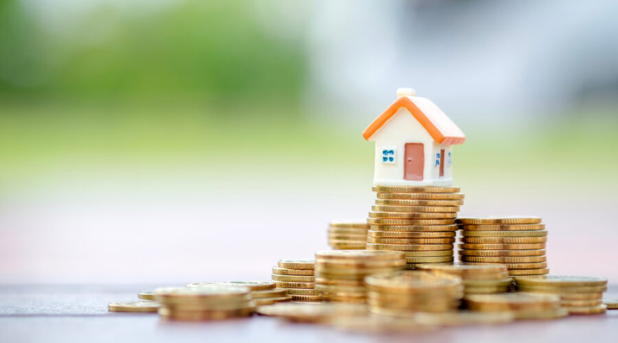 House on pile of coins