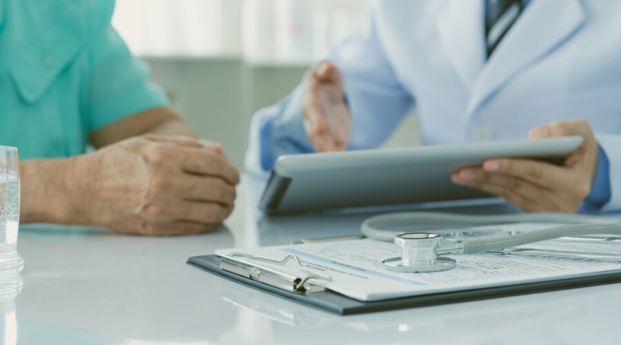 Doctor consulting with patient