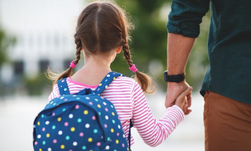 Parent walking child to school