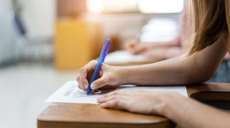 Student taking test, education accountability, open enrollment, education assessments, testing