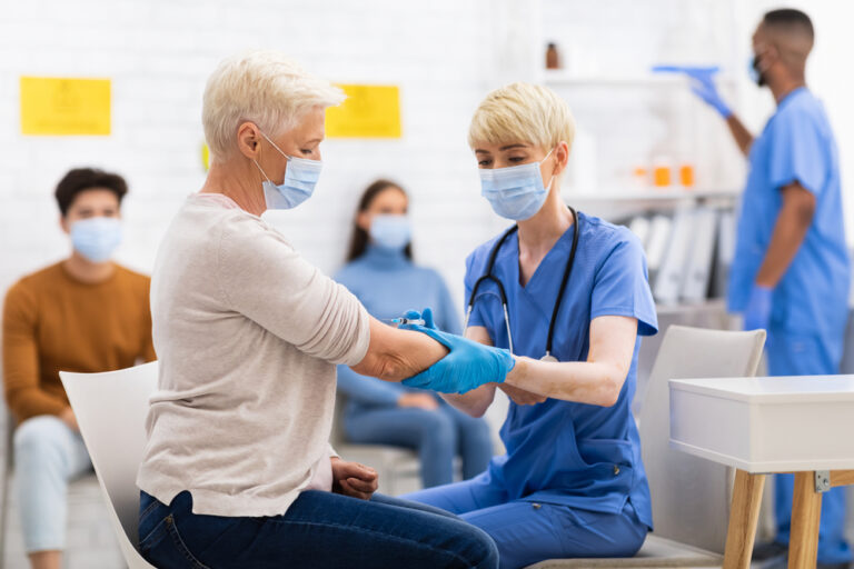 Woman receiving vaccine