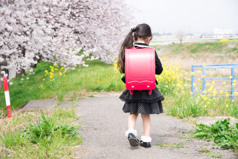 Young girl walking alone to school