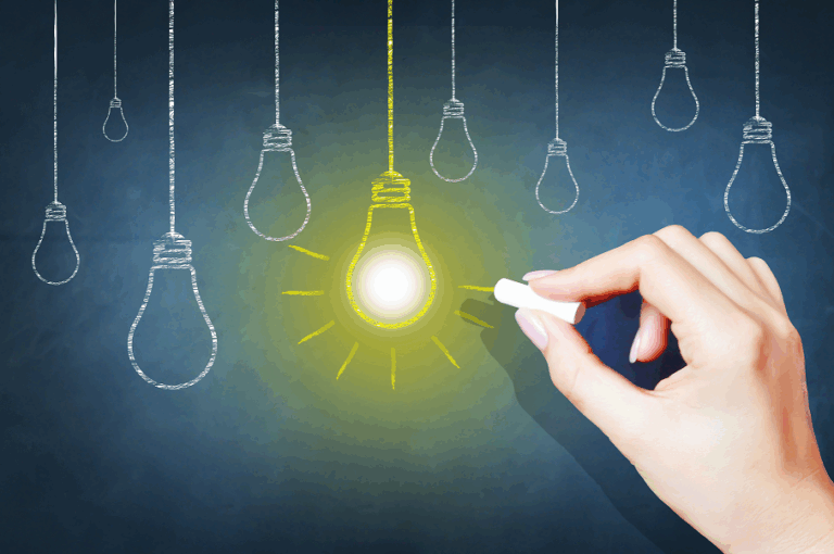 Light bulbs on chalkboard