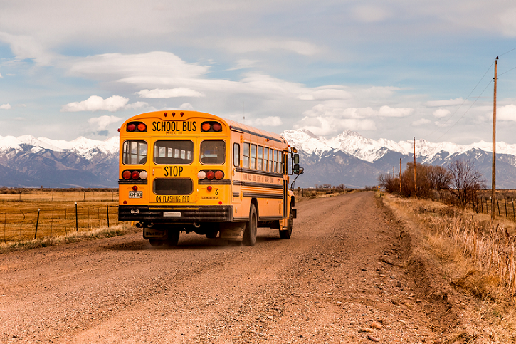 School bus driving on rural road