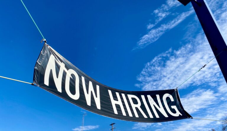 "Now Hiring" banner