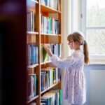 Child reading, early literacy reform, three cueing, phonics instruction
