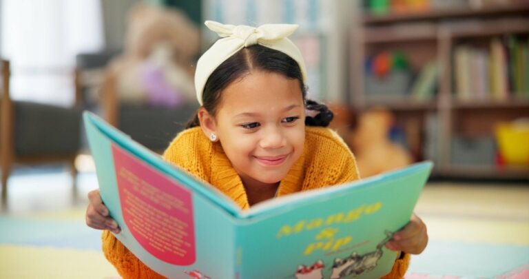 Girl reading book, literacy policy, Missouri reading scores, phonics, three cueing method